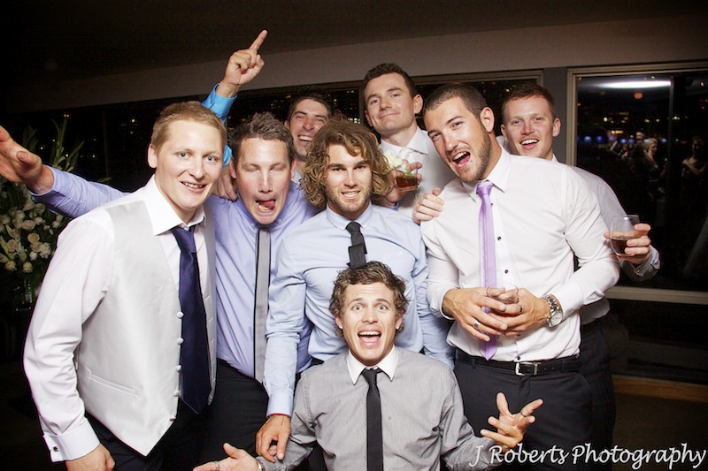 Groom and his mates larking around - wedding photography sydney